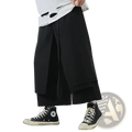 Black hip hop cargo jogger pants for men with wide-leg, layered asymmetrical design and subtle pleats in streetwear style