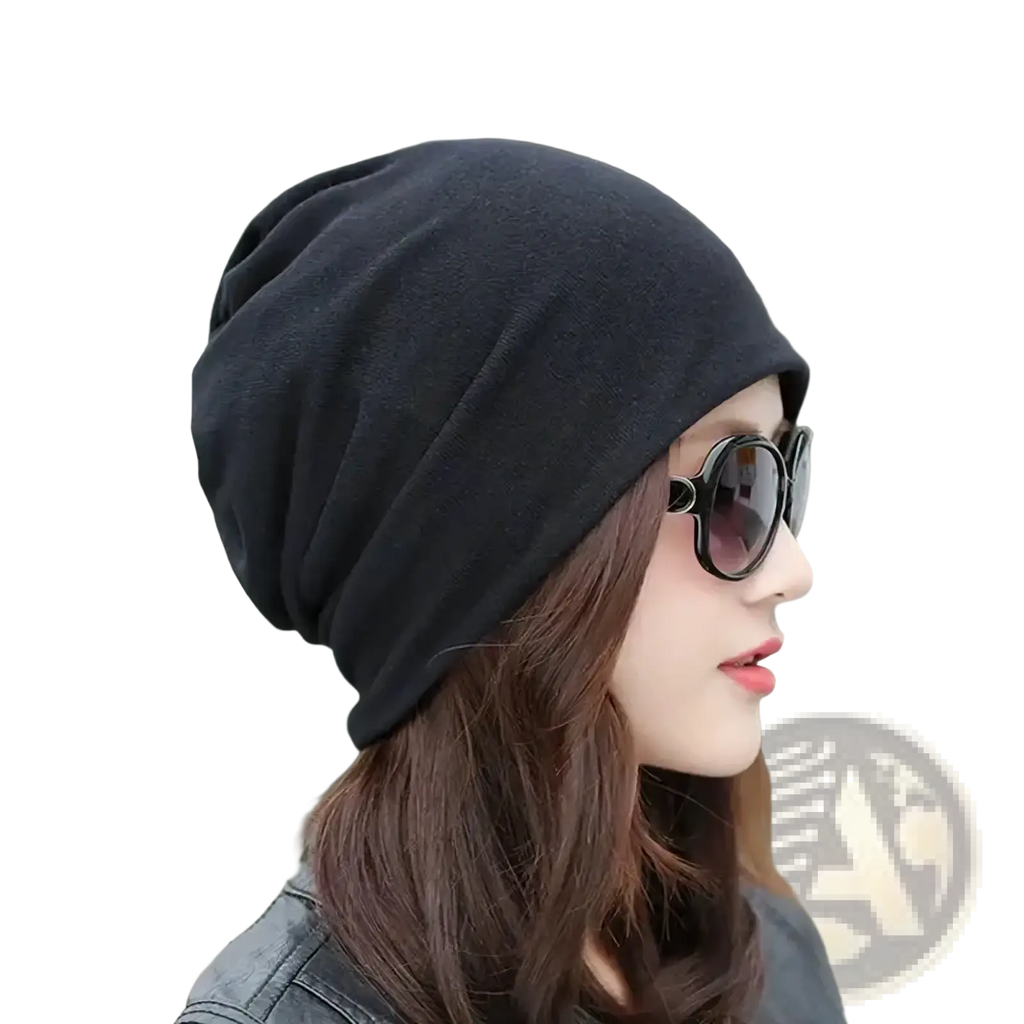 Black slouchy knit beanie hat with hip hop newspaper print design made of soft knit material for casual wear