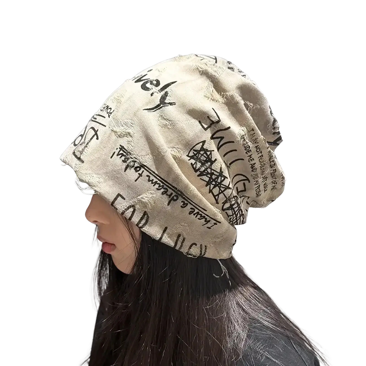 Beige hip hop newspaper print knit slouchy beanie hat with black handwritten text and distressed edges