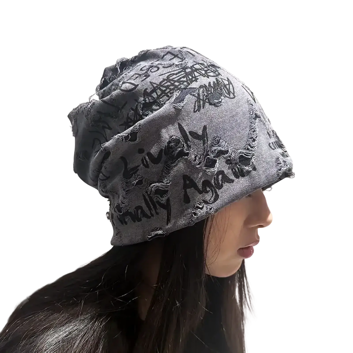 Gray knit hip hop beanie hat with newspaper print black graffiti lettering and distressed frayed edges
