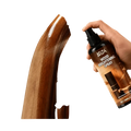 Black spray bottle of hiza wood brightening spray with brown label for wood polish spray and scratch remover