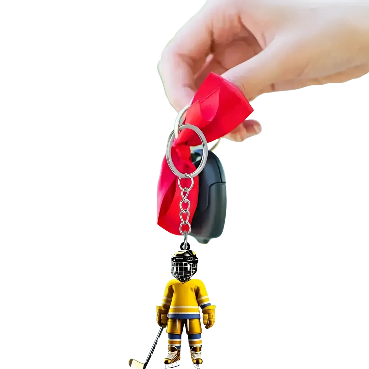 Yellow hockey player acrylic keychain with black helmet and gold accents for sports backpack charm