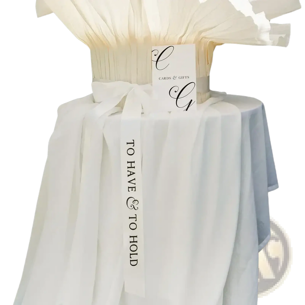 White satin wedding ribbon band featuring black cursive text to have and to hold for bridal use