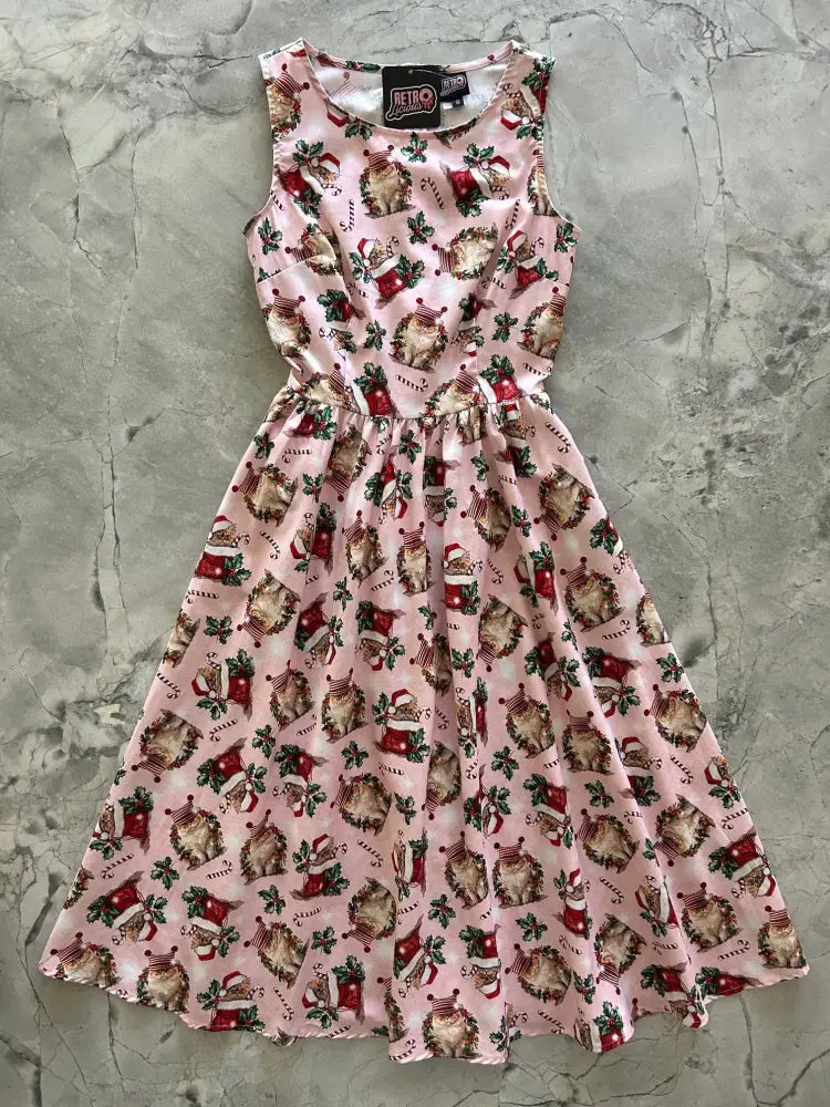 Pink cotton 1950s vintage midi dress with festive hedgehog santa hat pattern and holiday stockings and holly design