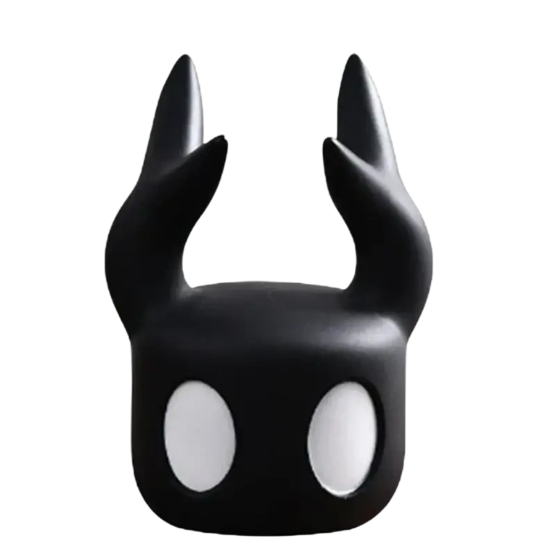 Black glossy hollow knight game controller stand for ps5 featuring two pointed horns and large white oval eyes