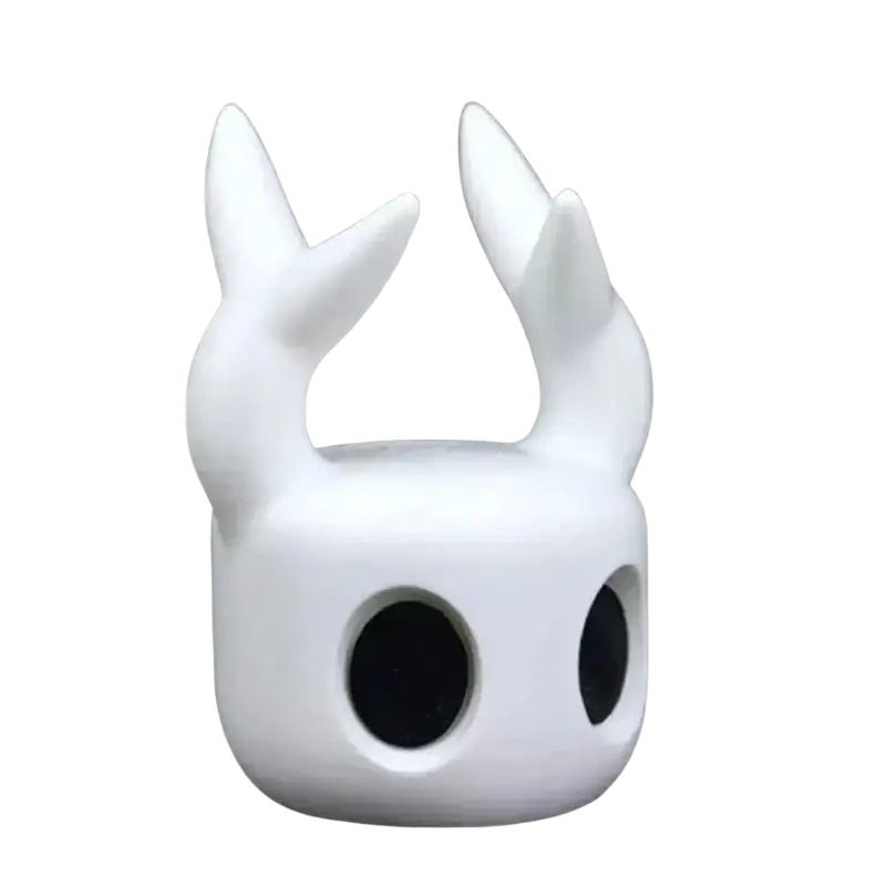 White smooth-surfaced hollow knight game controller stand for ps5 with two upward-curving horn-like protrusions and large black eye openings