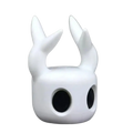 White smooth-surfaced hollow knight game controller stand for ps5 with two upward-curving horn-like protrusions and large black eye openings
