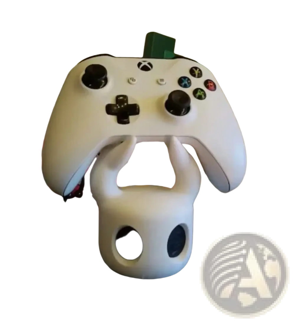 White skull-shaped hollow knight gaming controller stand holding a white Xbox controller for display and storage