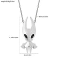 Silver hollow knight pendant necklace featuring a sleek stylized design with black eye accents for gaming fans