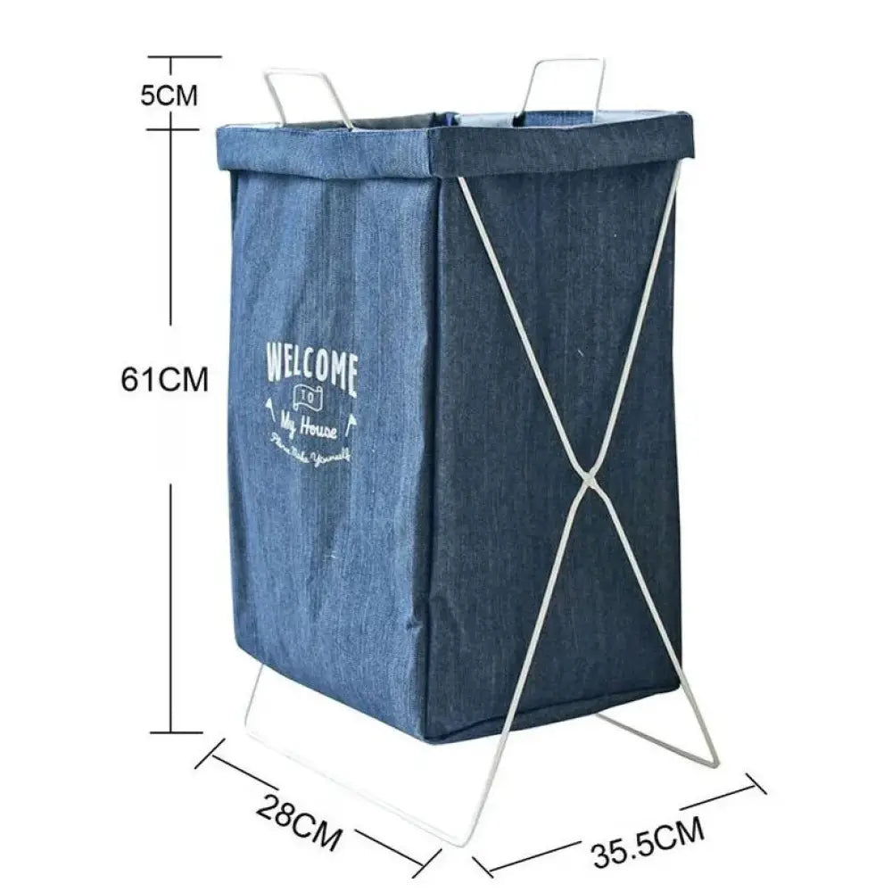 Embroidered denim laundry basket with white metal frame and handles featuring welcome to my house design