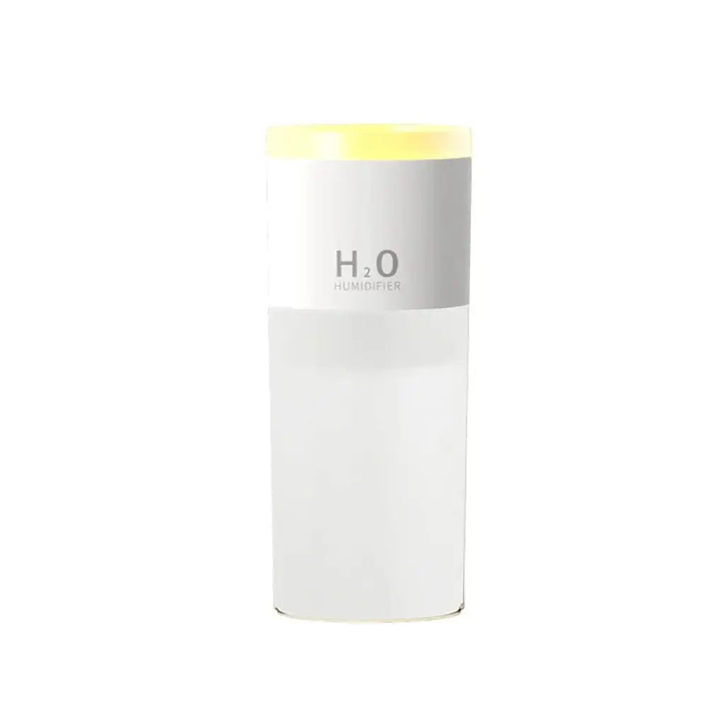 A sleek white portable USB LED mist humidifier with a yellow lid and h₂o humidifier branding for aroma diffusion