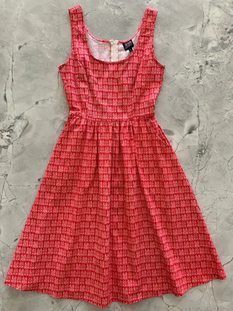 Home Sweet Home red house print cotton fit and flare dress with fitted bodice sleeveless design and subtle geometric pattern