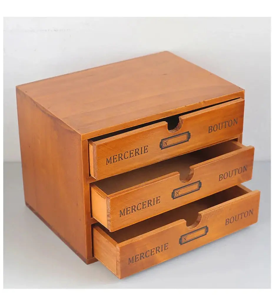 Retro lockable wooden storage box in light brown with three vintage drawers labeled mercerie and bouton