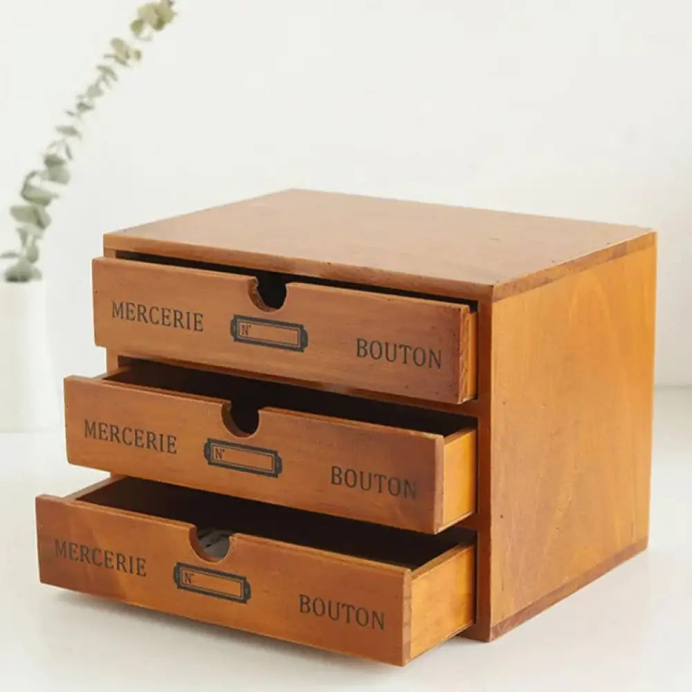 Retro lockable wooden storage box with vintage warm-toned three-drawer organizer engraved mercerie and bouton labels