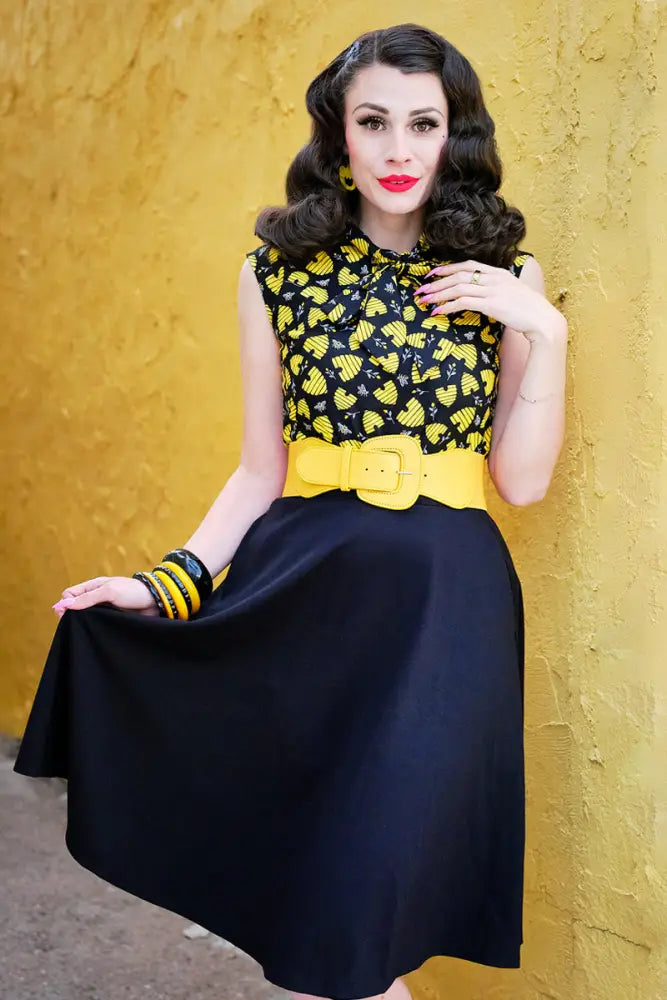 Honey Hives vintage 1950s black and yellow patterned sleeveless cotton top with high neckline and matching navy skirt