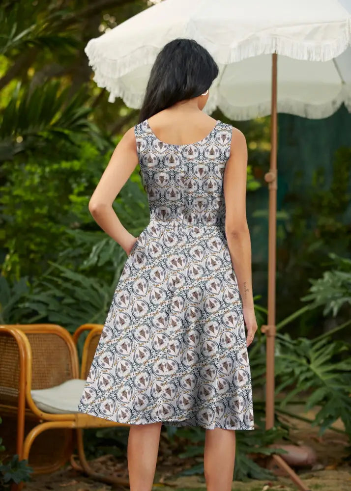 Honey Im Home retro sleeveless cotton fit and flare dress in white and navy with an intricate circular pattern