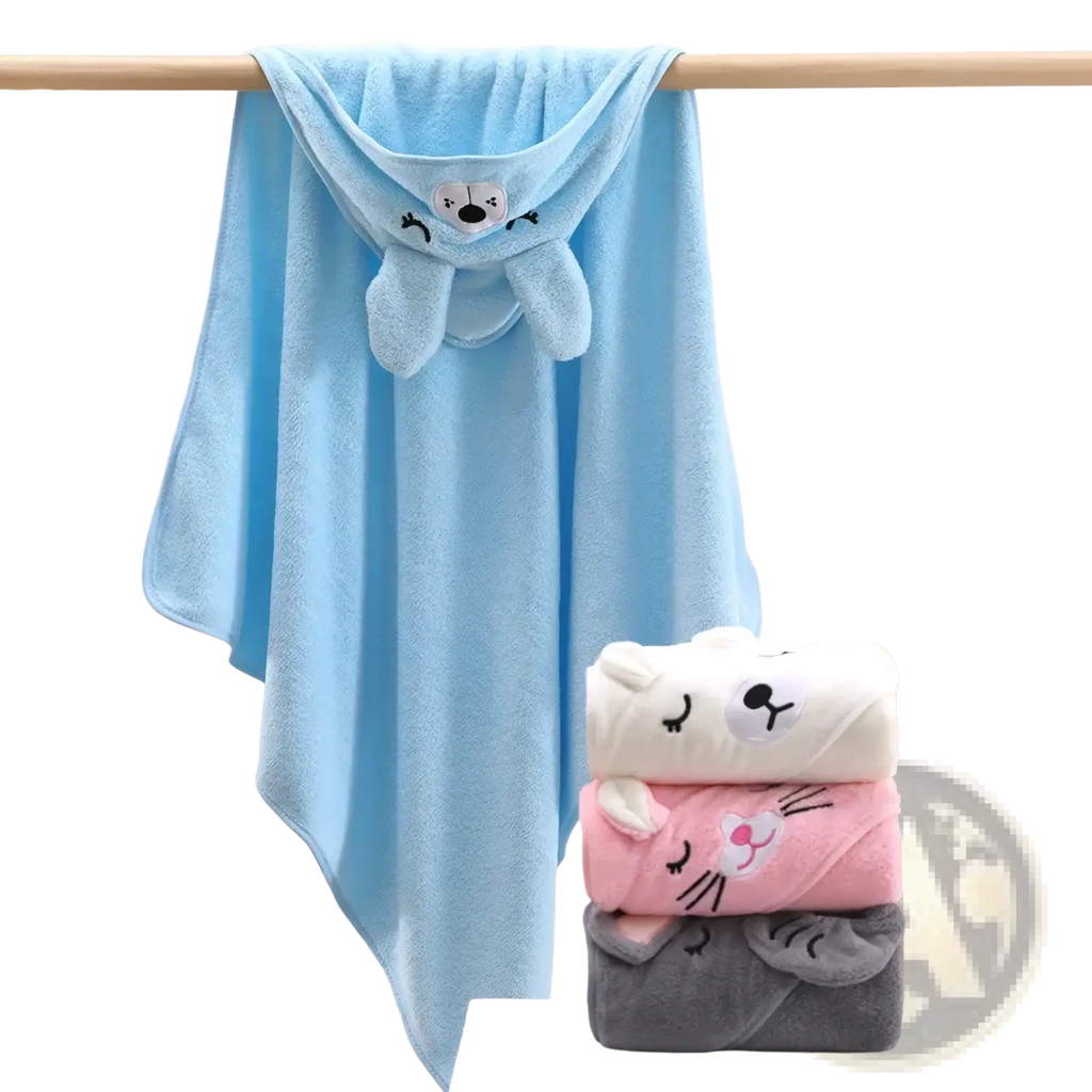 Light blue plush hooded baby bath towel with a cute bunny face design made of soft cotton hanging on a wooden rod