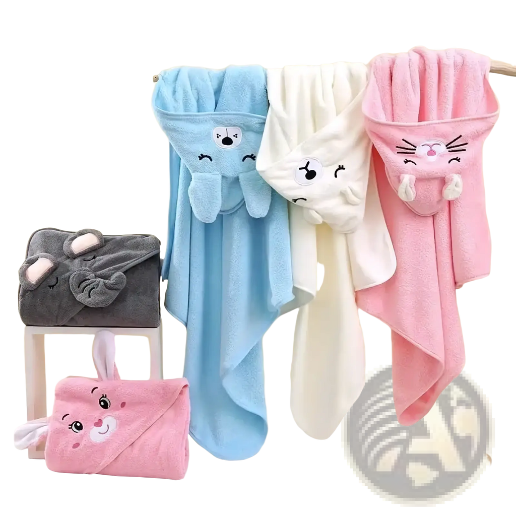 Soft cotton hooded baby bath towels in pastel blue white and pink with embroidered bunny faces and floppy ears for swaddling