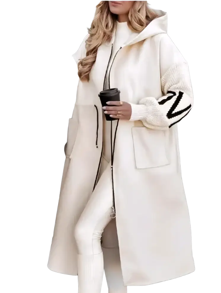 Cream longline hooded trench coat with black zipper and contrasting knitted sleeves featuring bold black lettering