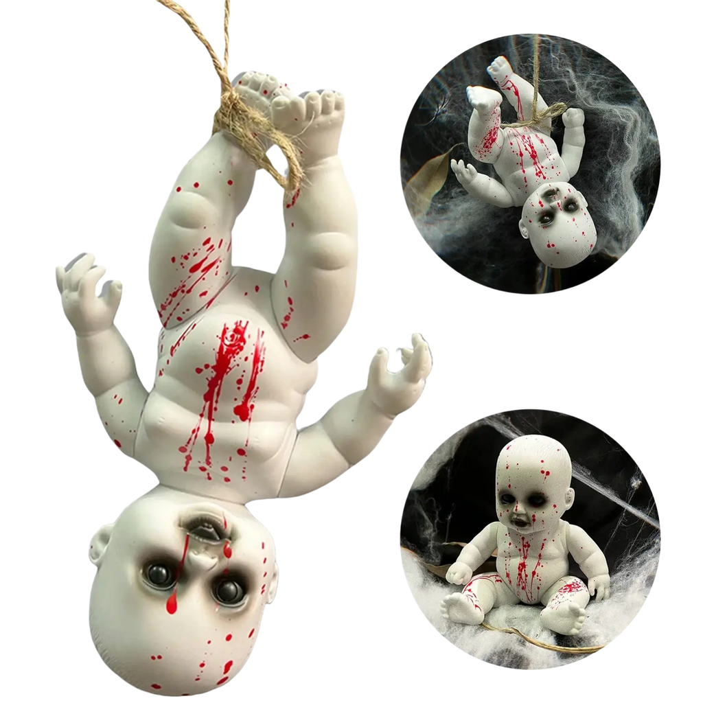 White plastic gothic horror doll with red splatter paint and black eyes hanging by a rope for halloween decor