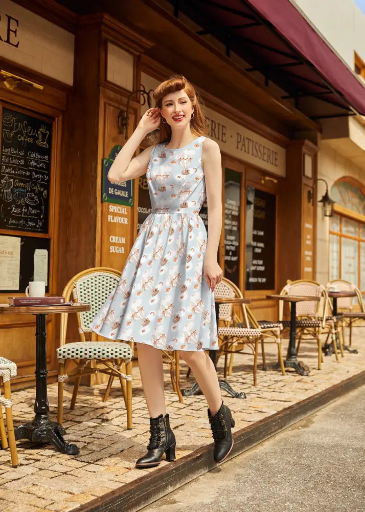 Light blue cotton sleeveless vintage hot air balloon a-line dress with colorful cartoon animals and clouds pattern