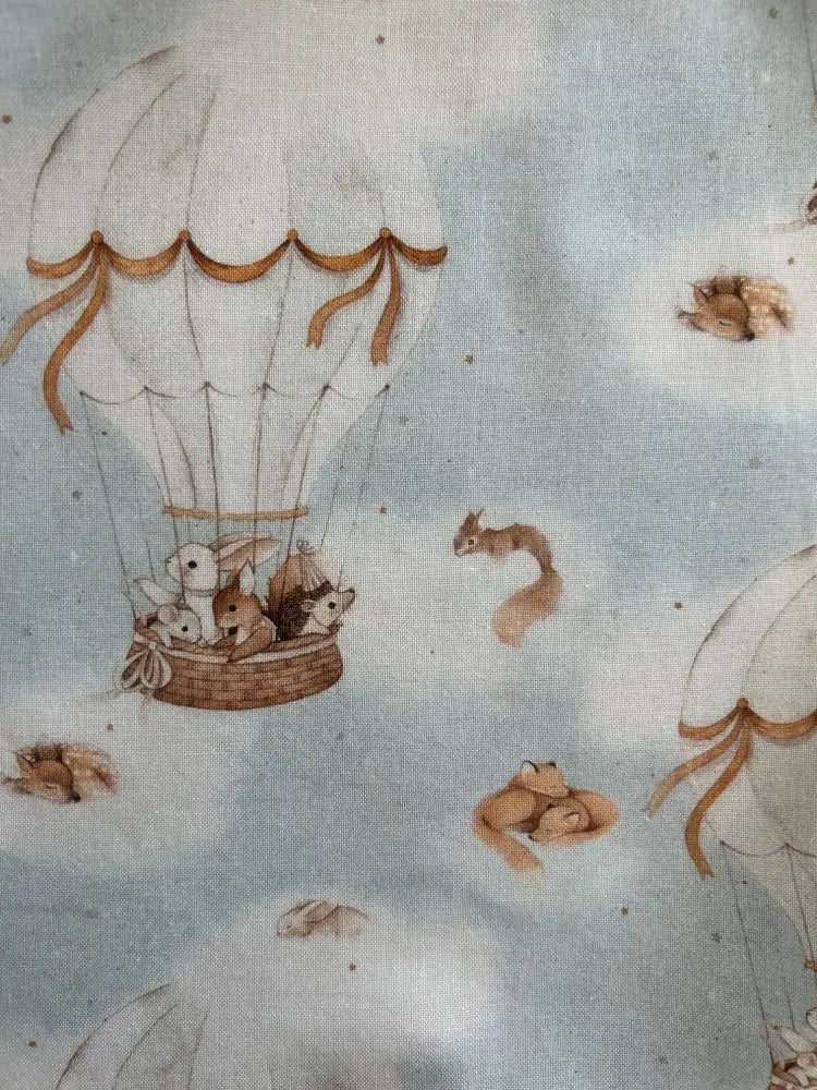 Vintage hot air balloon cotton A-line dress with soft blue fabric featuring woodland animals in a hot air balloon ride
