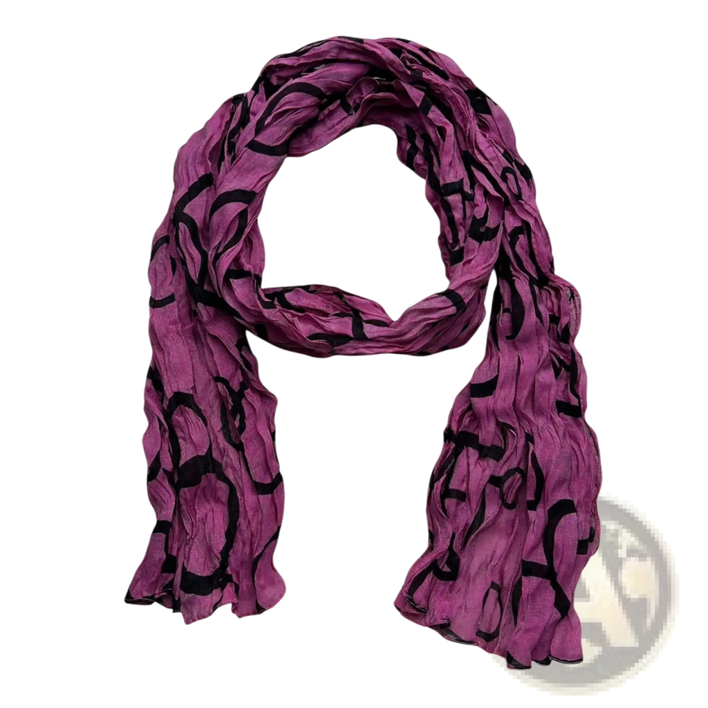 A hot pink crinkle polyester scarf with lightweight flowing fabric and a black abstract pattern