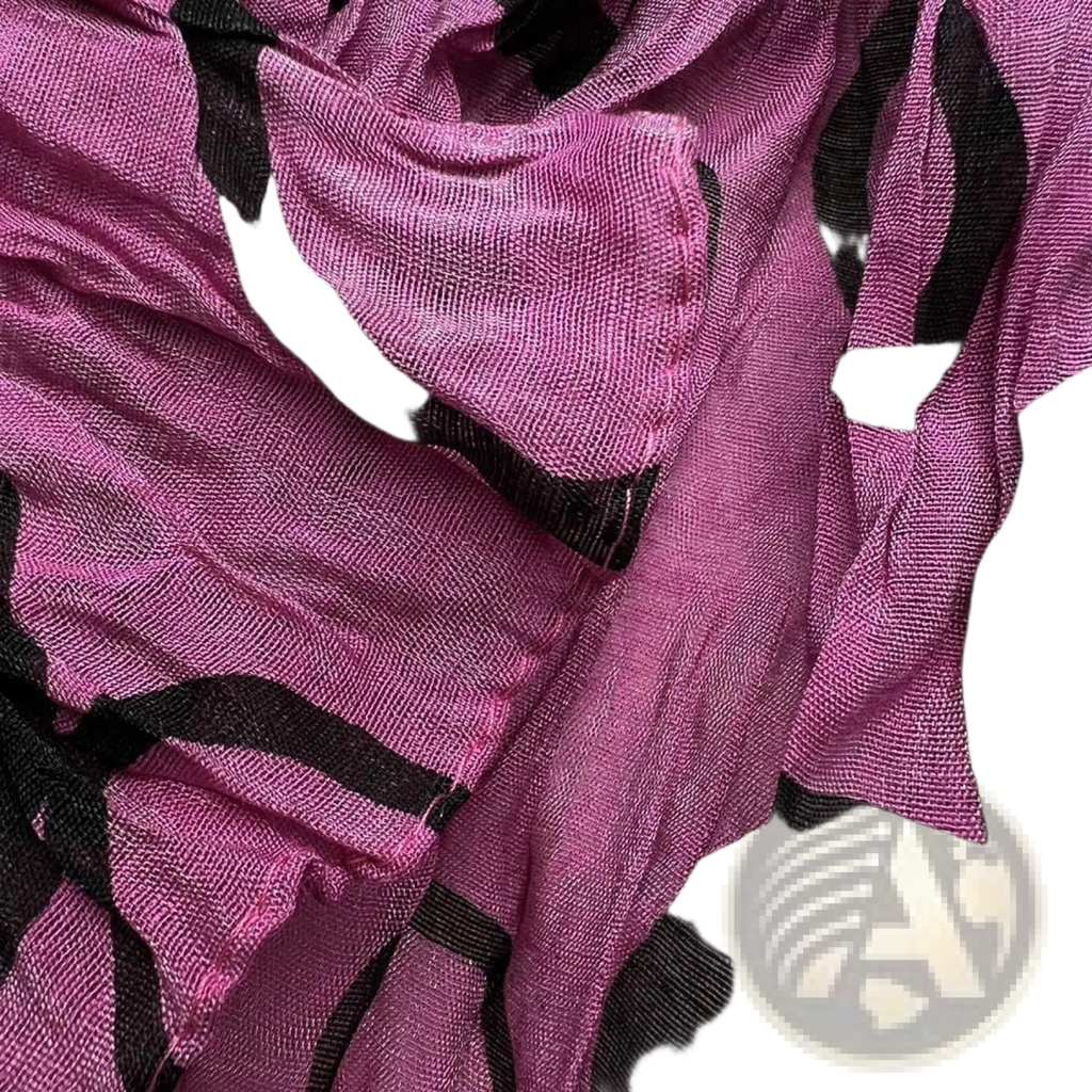A soft sheer hot pink crinkle polyester scarf with bold black geometric patterns