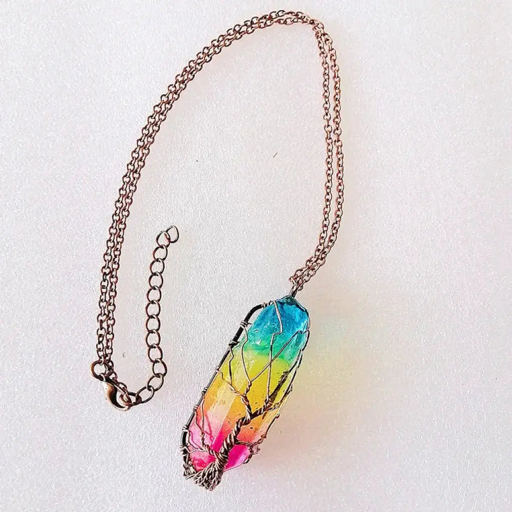 Rainbow tree of life crystal pillar pendant necklace featuring a vibrant rainbow crystal with wire-wrapped design and copper chain