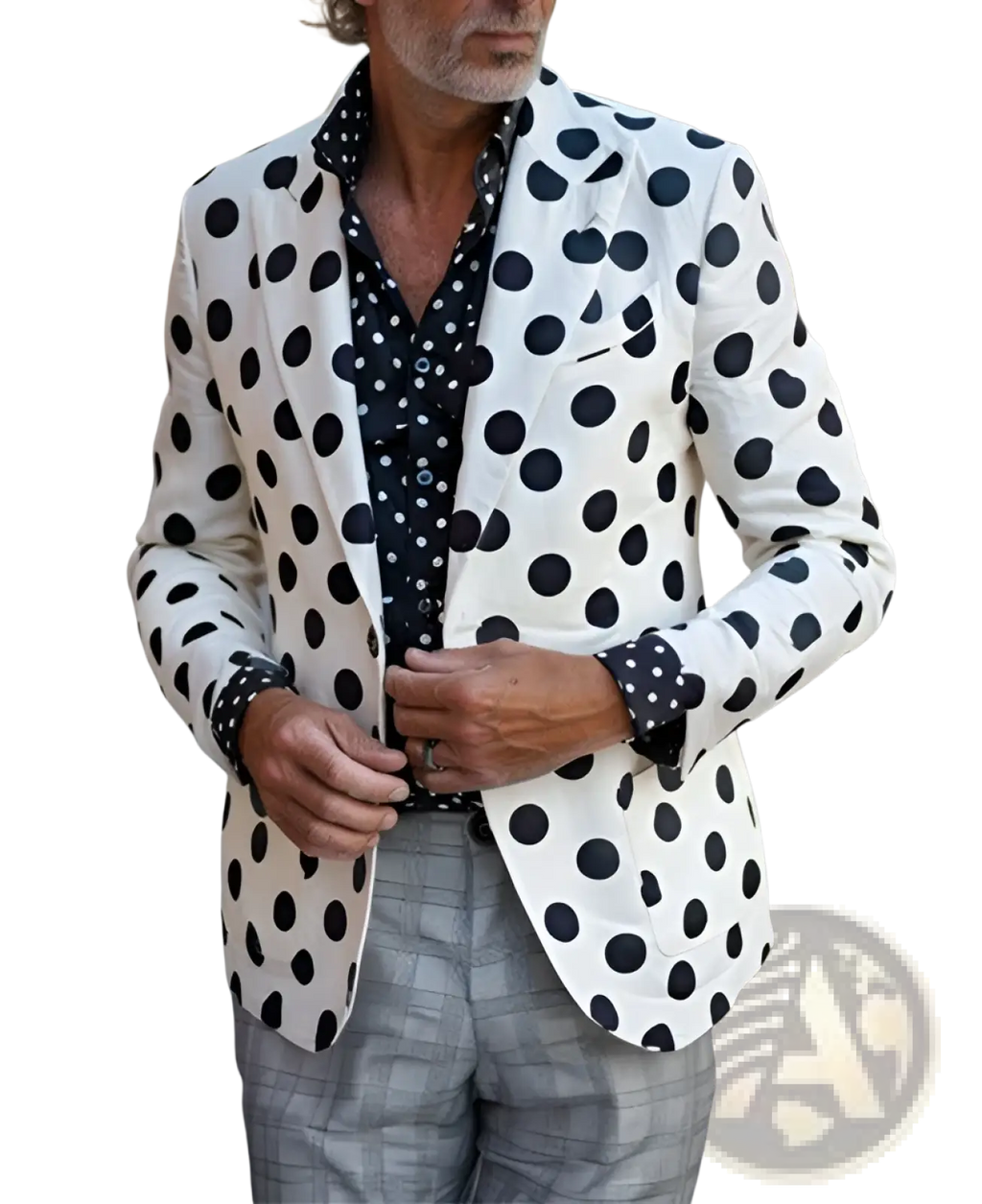 A man wearing a houndstooth slim fit suit jacket in white with black polka dots paired with gray plaid trousers