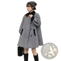 A black and white houndstooth wool blend blazer coat with contrasting black collar cuffs and front pockets