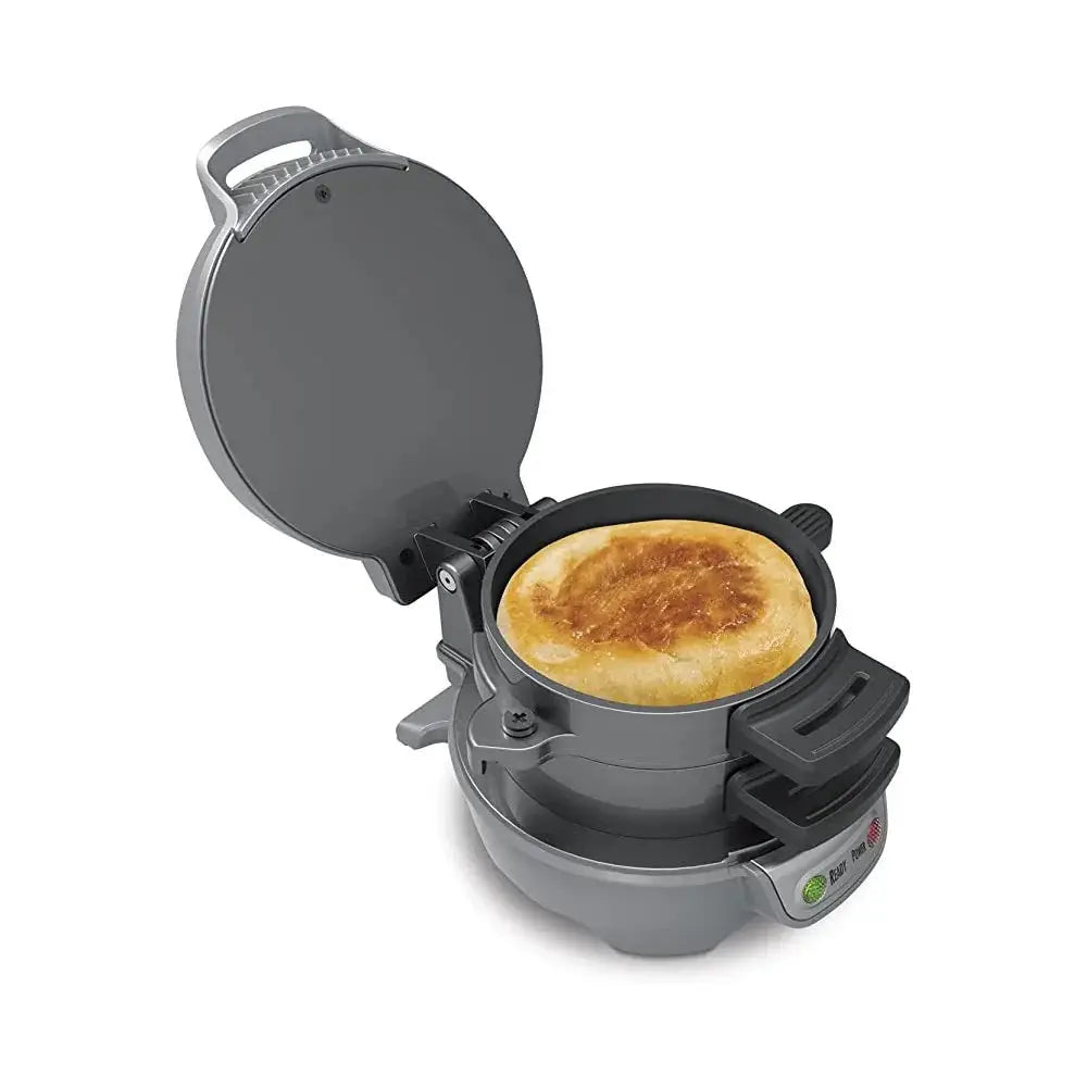 Gray electric multifunctional breakfast sandwich and waffle maker cooking a golden-brown pancake inside