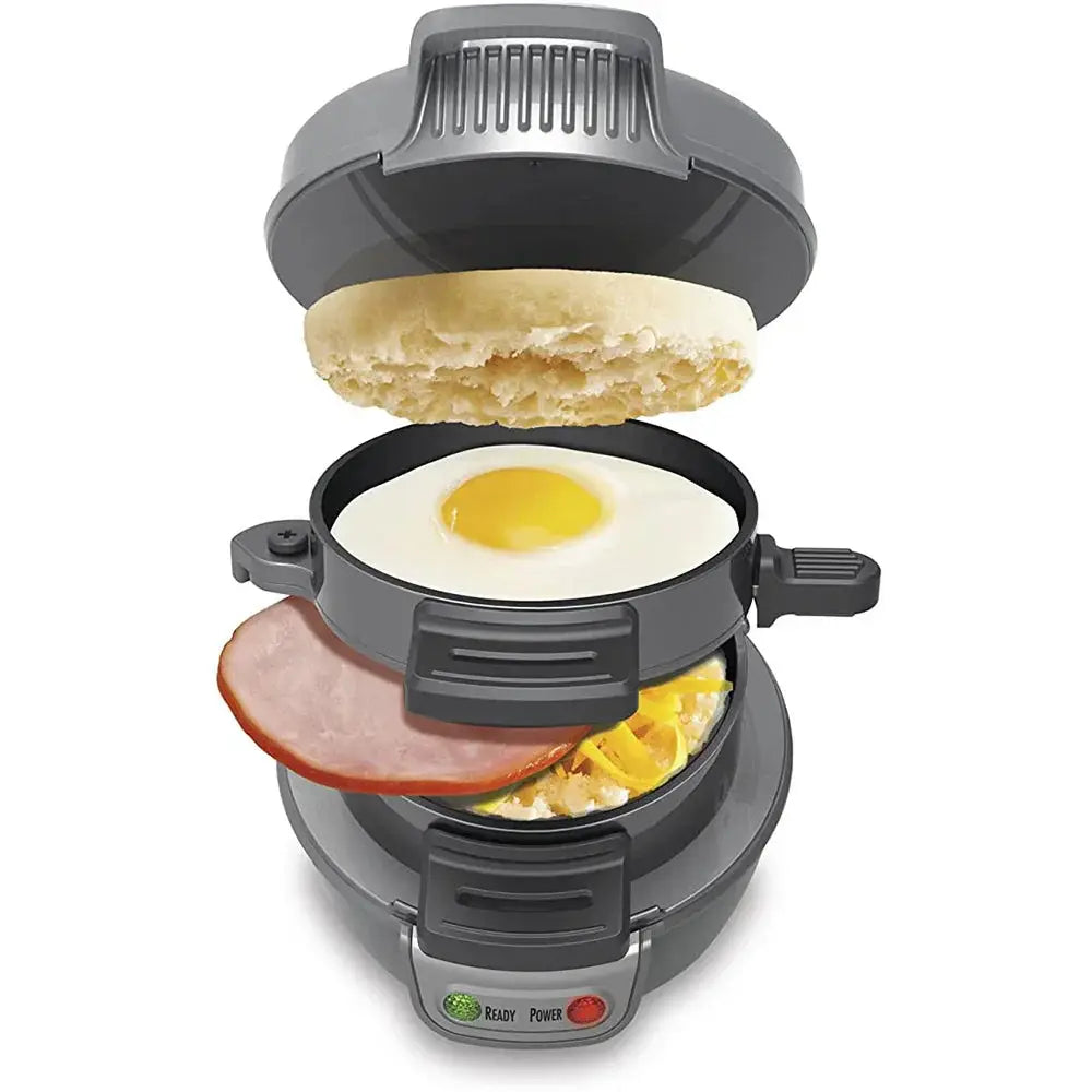 Gray electric multifunctional breakfast sandwich and waffle maker with fried egg ham slice and cheese inside cooking