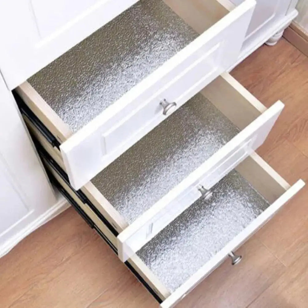 Silver glittery drawer liner featured with complete household kitchen utensil set for everyday cooking use