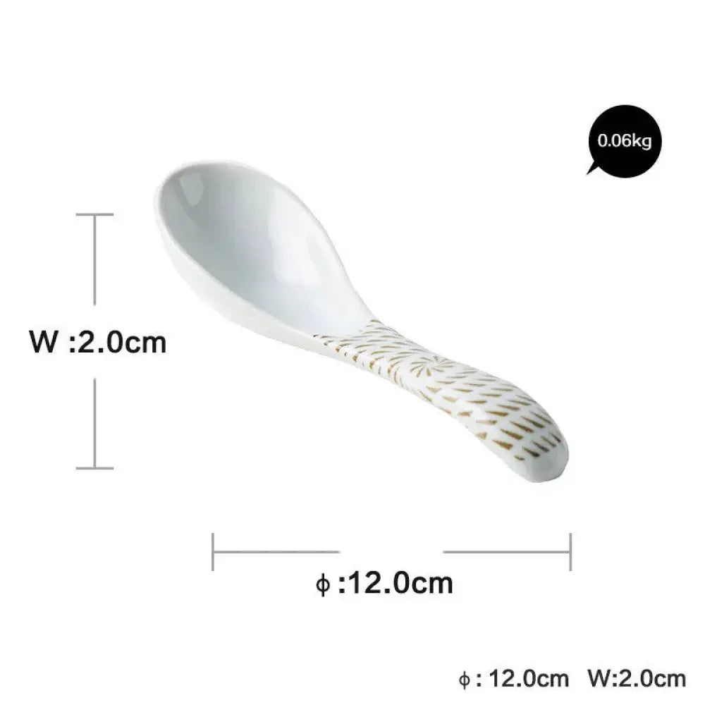 White ceramic spoon with delicate gold leaf pattern handle from minimalist Japanese ceramic tableware dining set