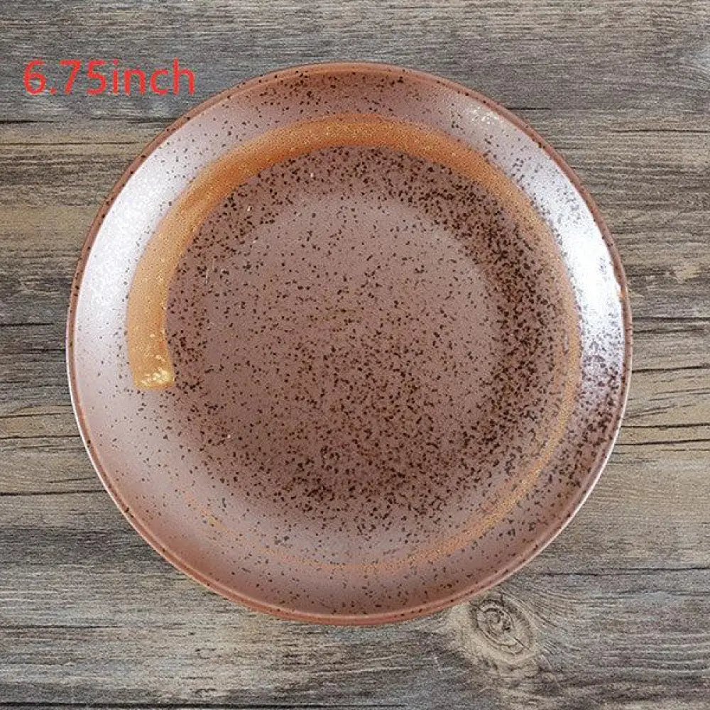 A minimalist Japanese ceramic tableware dining set featuring a rustic speckled brown ceramic plate with an orange rim