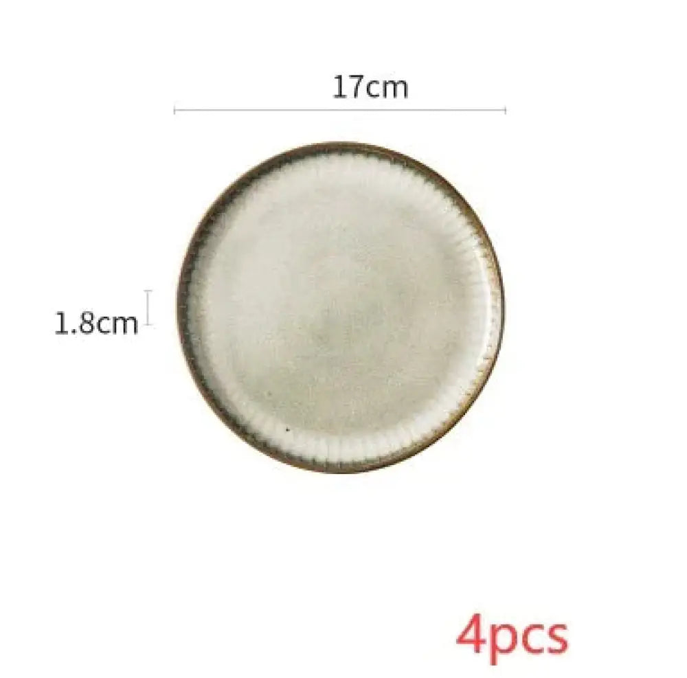 A nordic ceramic dinnerware set plate with a 17cm diameter off-white glaze and textured dark brown rim