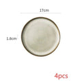 A nordic ceramic dinnerware set plate with a 17cm diameter off-white glaze and textured dark brown rim