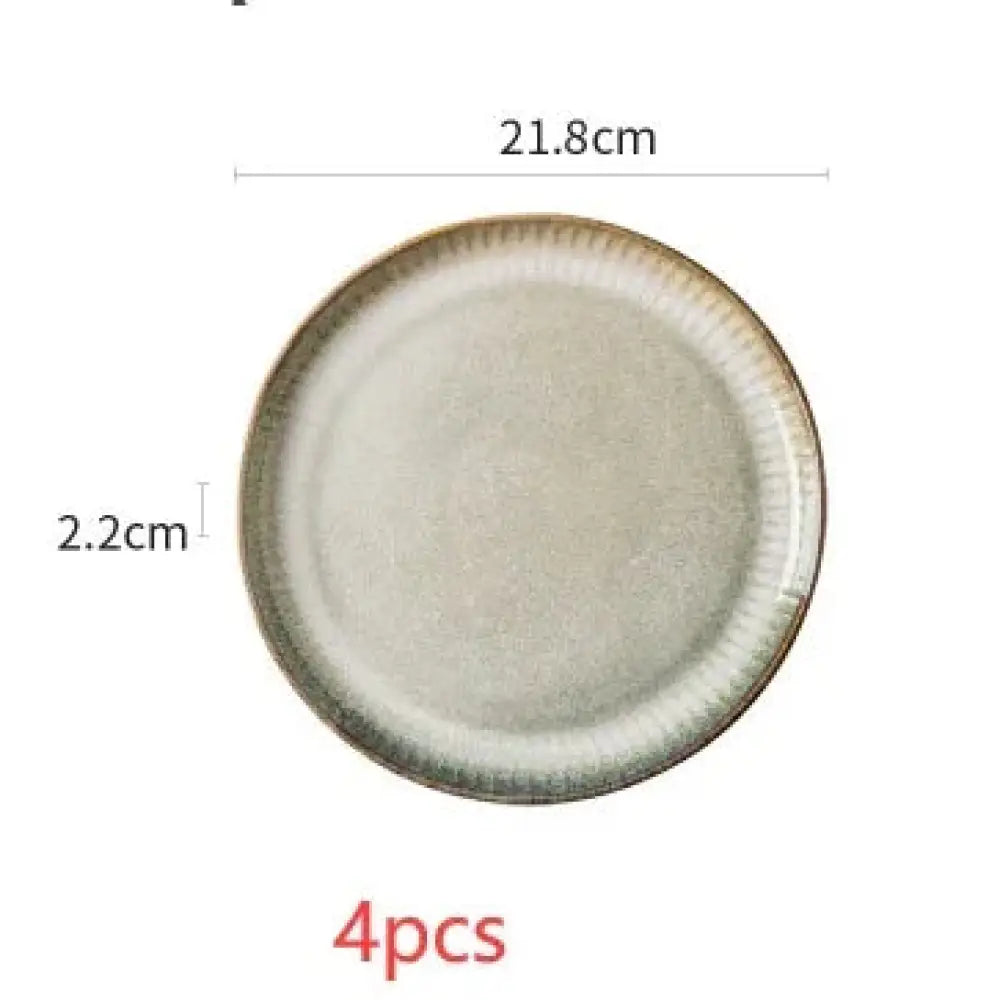 A round ceramic plate with a subtle speckled beige glaze and textured darker rim from nordic ceramic dinnerware set