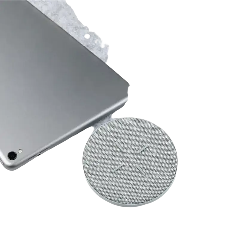 Silver circular wireless charger max 27w with mesh grille and minimalist design for efficient wireless charging by Huawei