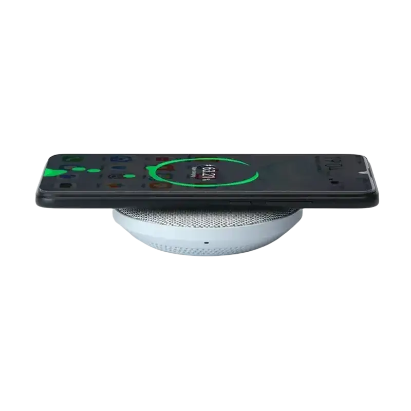 White circular wireless charger max 27w with textured surface and perforations charging black smartphone wirelessly