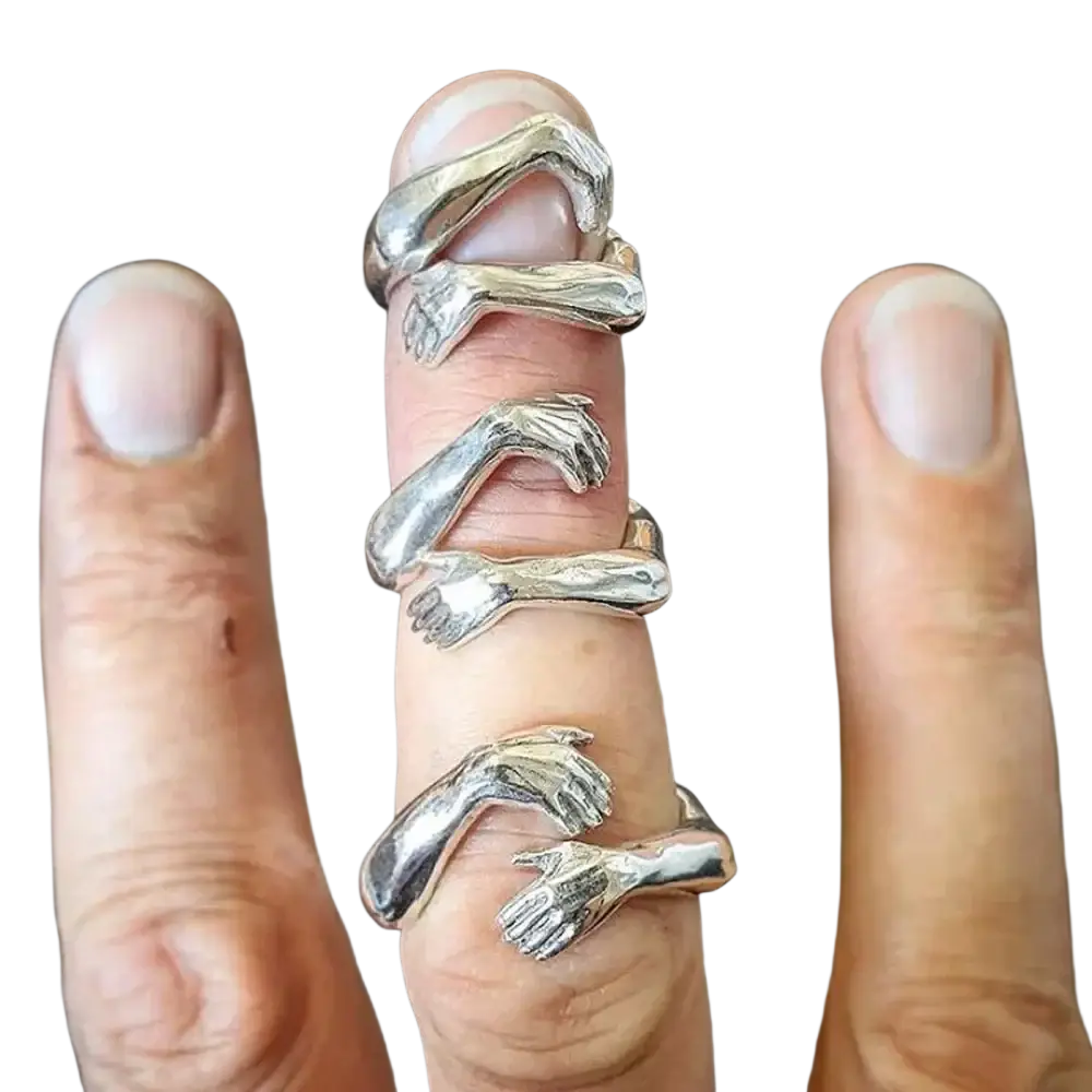 Silver-toned hugging hands open ring in zinc alloy with intricate design stacked on a finger
