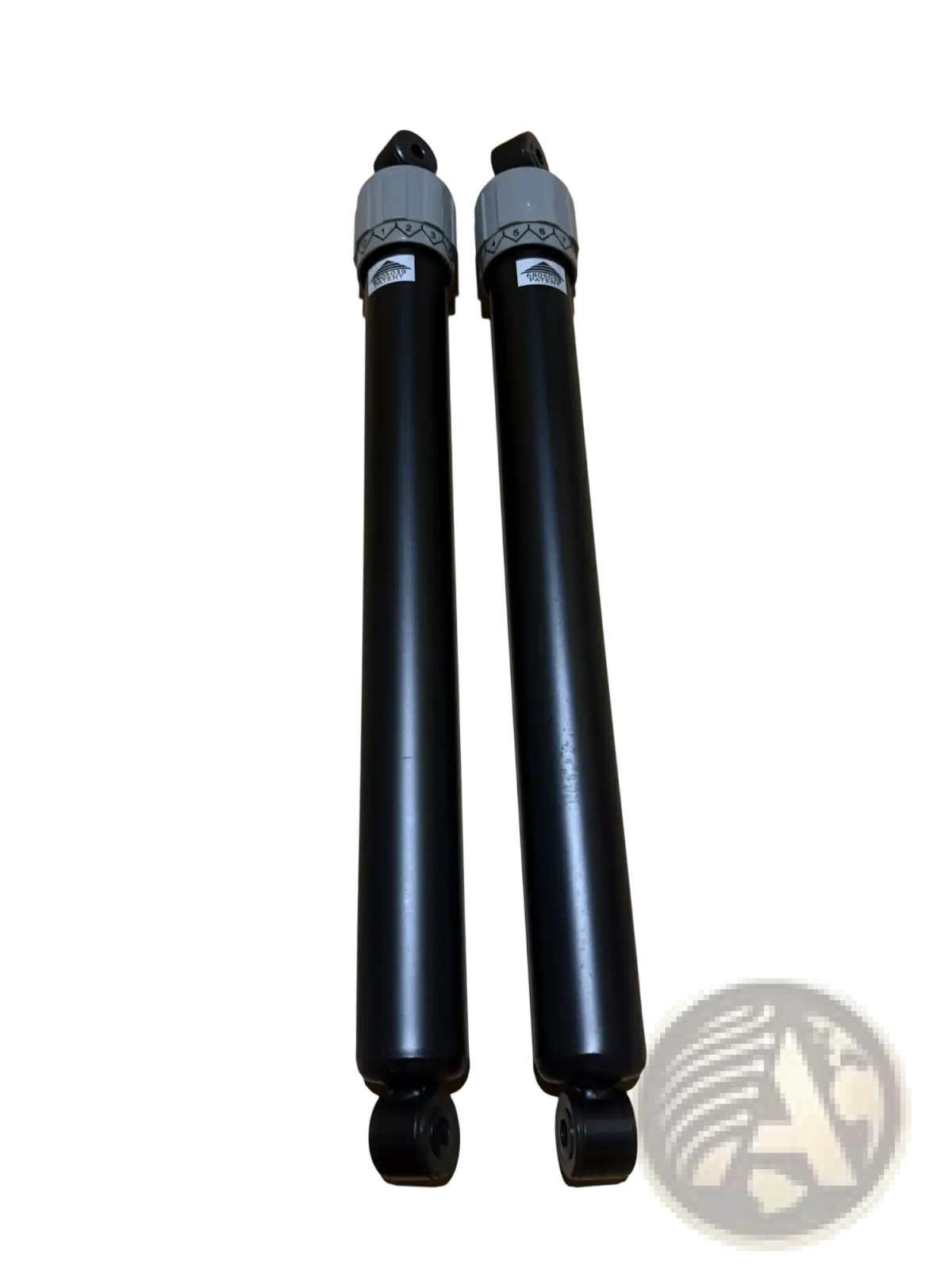 Black hydraulic cylinder rowing machine resistance regulator with gray caps and decorative bands in sleek design