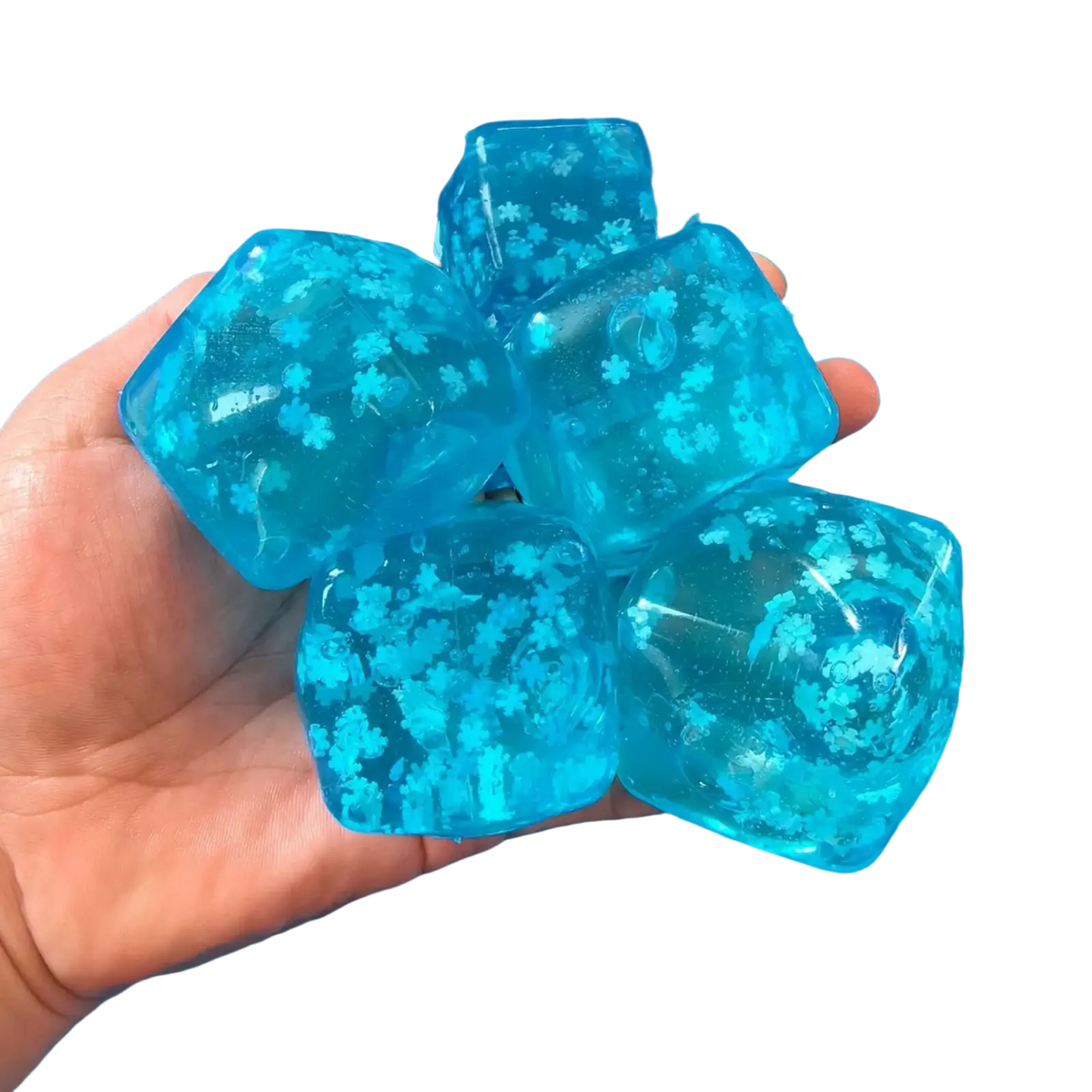 Blue translucent gel ice cubes with white snowflake patterns slow rising sensory fidget toy for tactile play