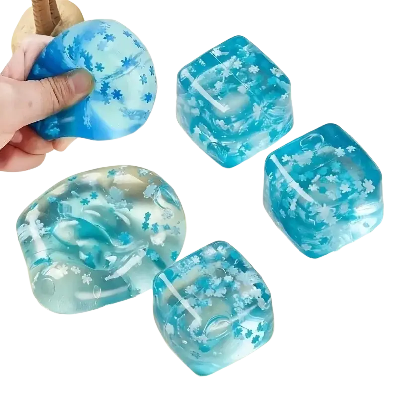 Blue translucent ice cubes slow rising squishy gel cubes with white snowflake patterns for sensory fidget toy use