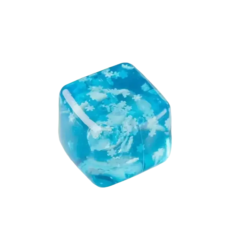 A translucent blue ice cubes slow rising squishy sensory fidget toy with embedded white snowflake patterns