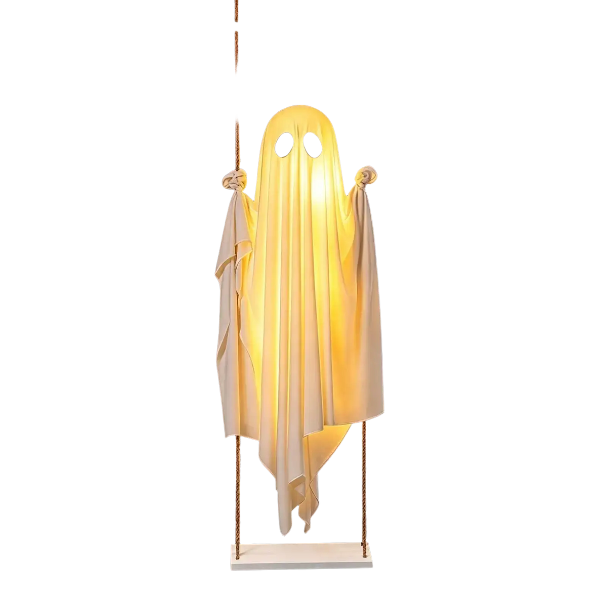 A glowing white swinging ghost decor illuminated with warm yellow light hanging from a tree for outdoor halloween