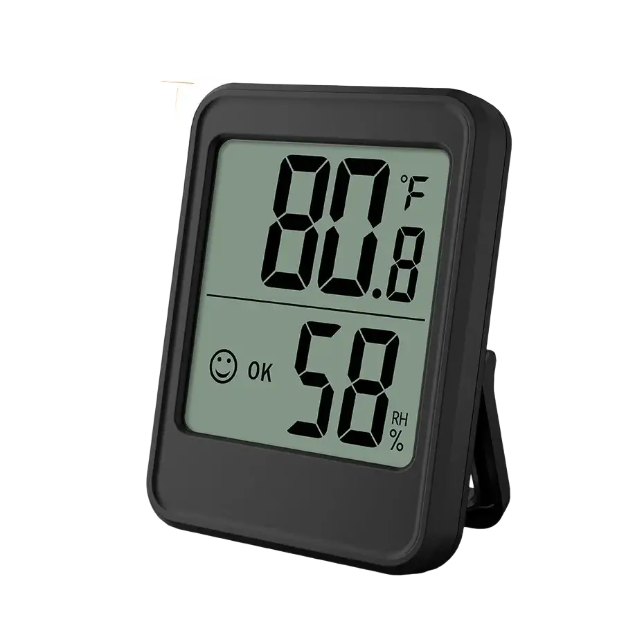 Black indoor digital temperature humidity meter with stand displaying 80.8°f and 58% rh with smiling face icon
