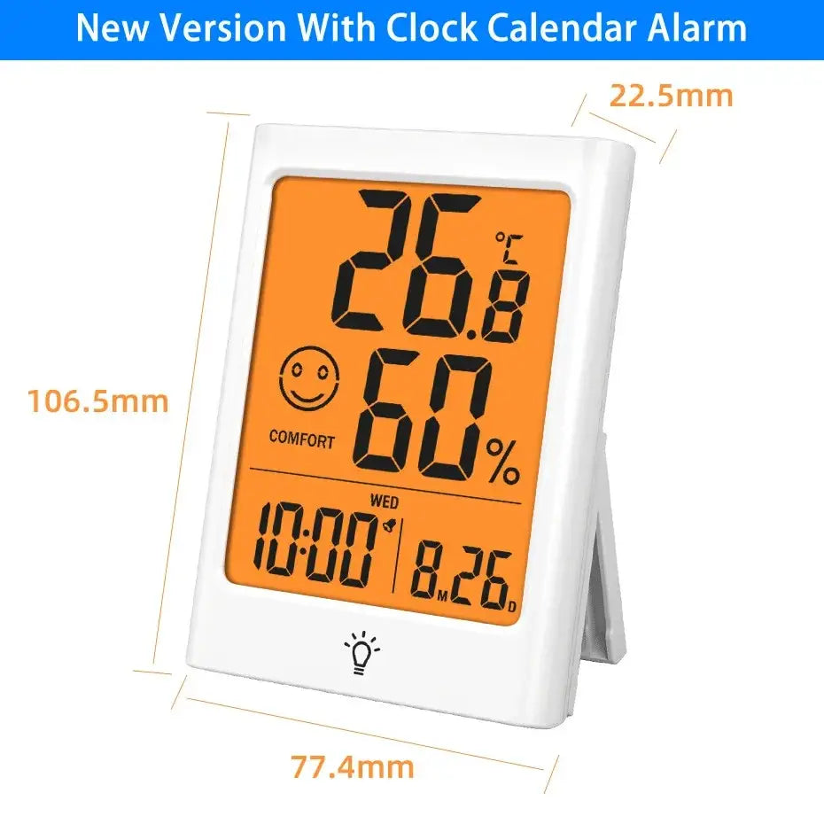 White rectangular indoor digital temperature humidity meter with orange display showing time date temperature and humidity