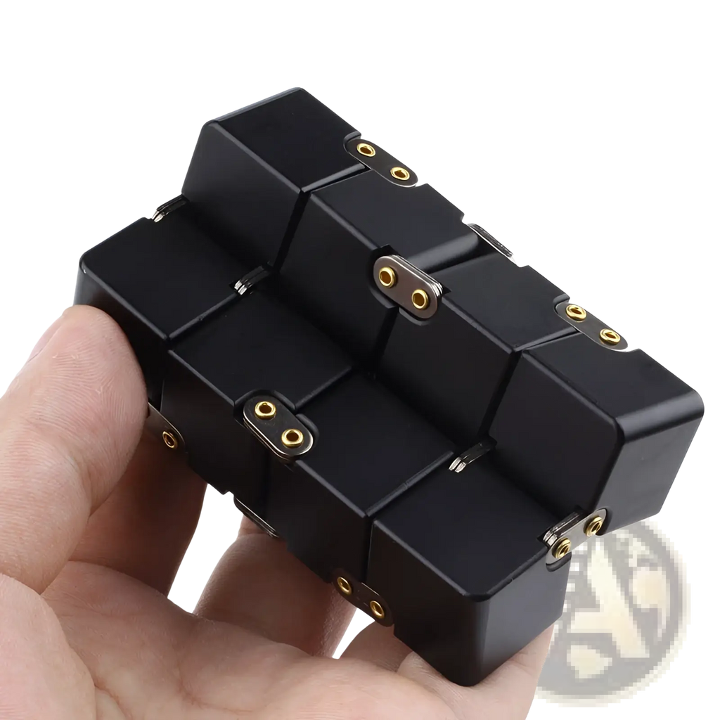 Black infinity cube fidget toy with gold-colored zinc alloy connectors for stress relief and tactile engagement